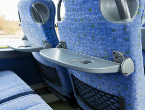 plastic tray table on a bus