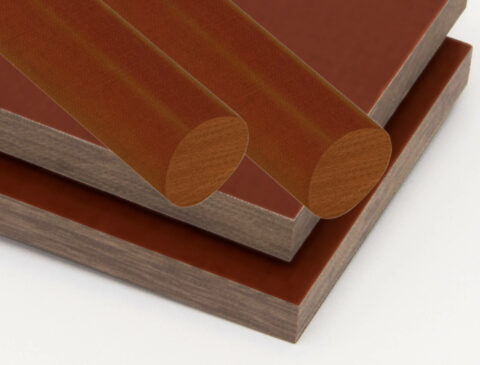 stacked sheets and rods of XX Paper Phenolic in brown
