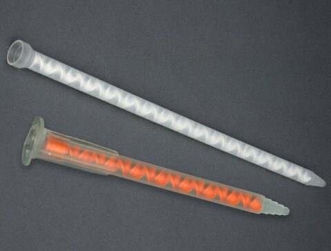 an orange and white static mixing nozzle