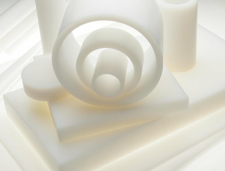 stacked sheets, rods, and tubes of white PFA