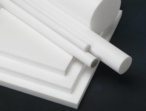 multiple stacked sheets and rods of PTFE in various sizes