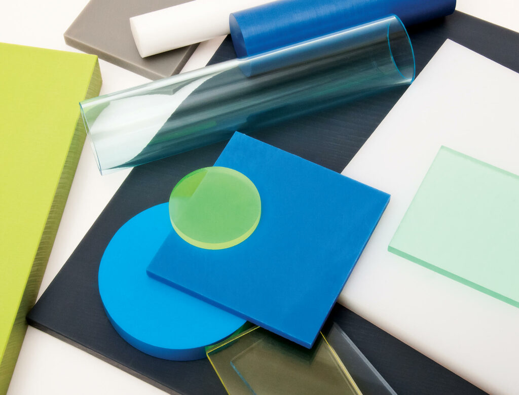 mix of sheets, rods, and tubes of plastics in various colors