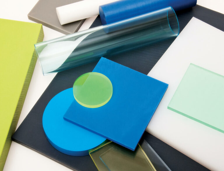 mix of sheets, rods, and tubes of plastics in various colors