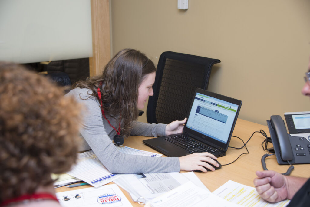 several Curbell employees looking at a computer during PSP training