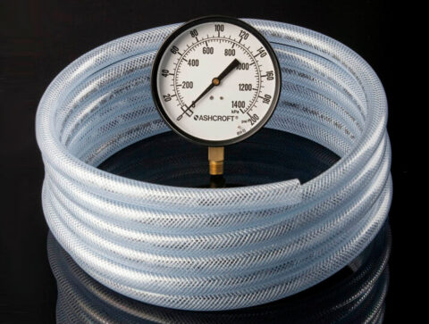 roll of vinyl hose with pressure gauge