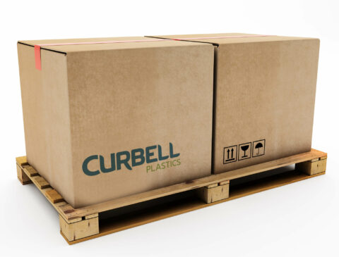two large boxes on a wood palette with Curbell logo printed on one box