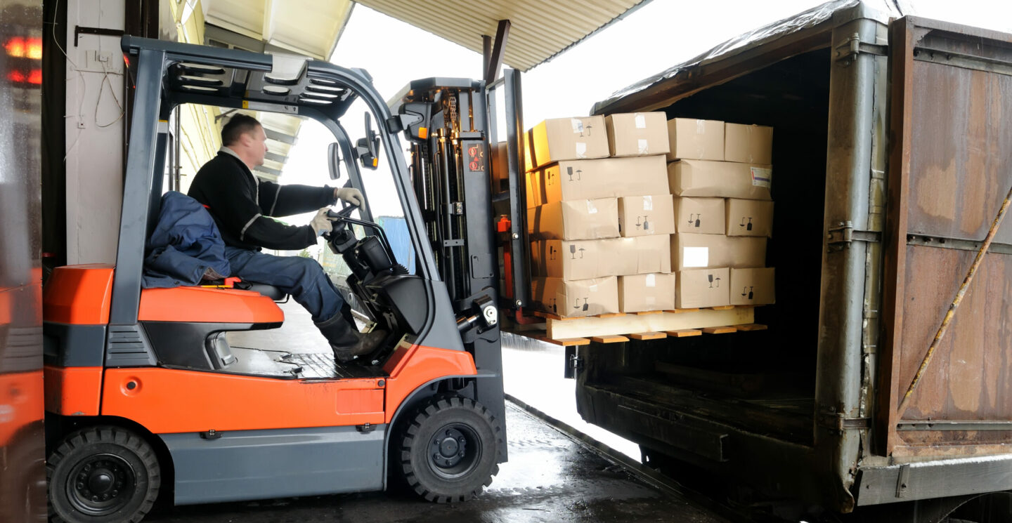 Electric,Forklift,In,Warehouse,Loading,Cardboard,Boxes